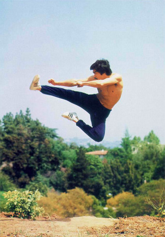 Bruce Lee training martial arts flying kick in air