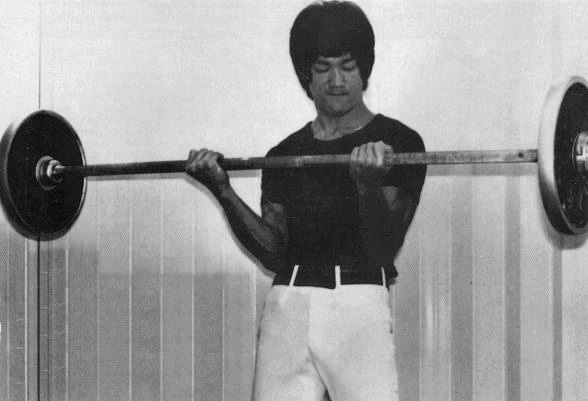 Bruce Lee weight training lifting barbell curls