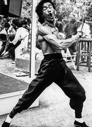 Bruce Lee body Enter the Dragon mid-punch muscles